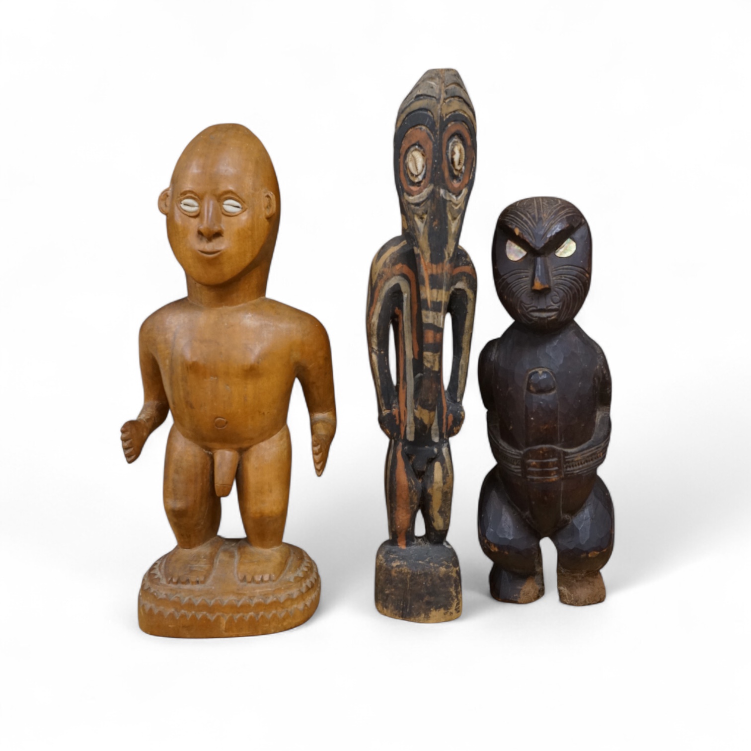 Three wood tribal figures, Africa, South Seas, tallest 37.5cm